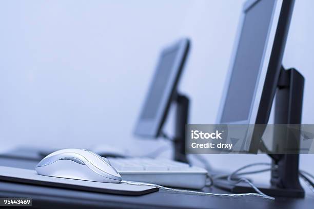 Close Up Of Mouse Sitting On Desk In Computer Room Stock Photo - Download Image Now - Arranging, Blue, Business