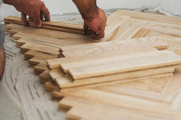 Parquet and carpenter concept stock photo