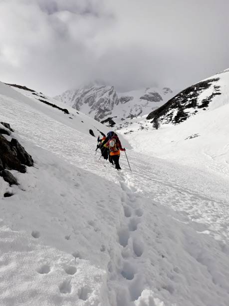 istock Alpinists in the Snowy Mountains 2 954442496