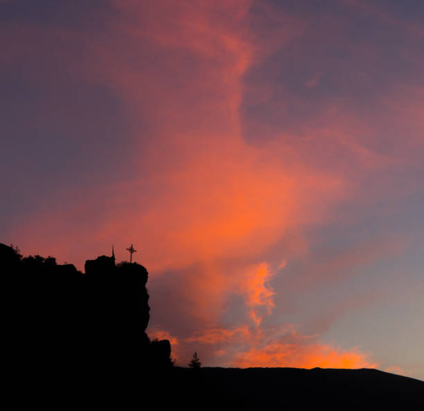 istock Silhouetted Cross at Sunrise 954451364