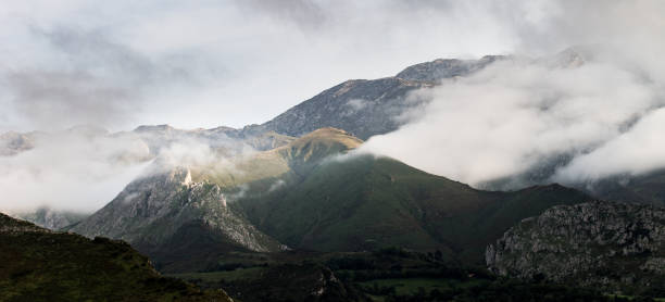 istock Panorama of Mountains Between the Clouds 954451432