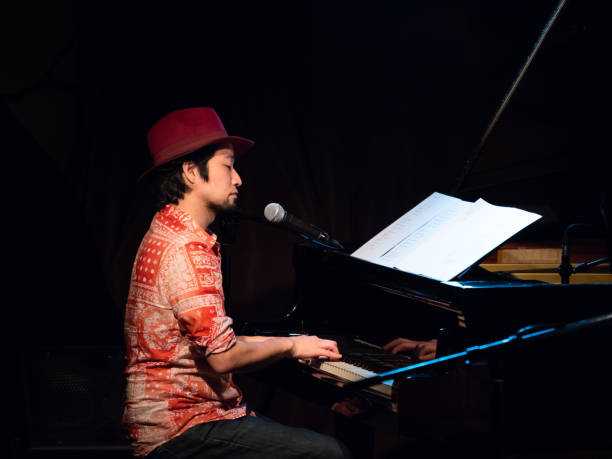 istock Asian pianist performing on stage 954456974