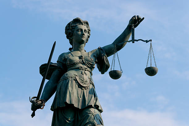 istock Statute of lady justice with sword and balancing scales 95445736