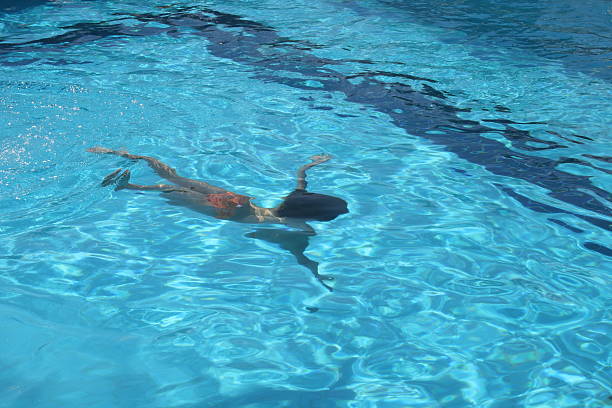 istock Girl swimming under the pool water 95445974