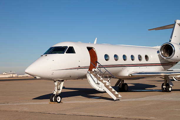 istock Small airplane on tarmac with door open and stairs down 95446678