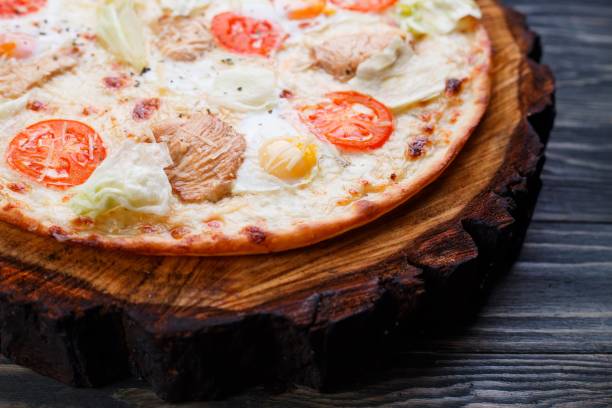 appetizing hot caesar pizza with cherry tomatoes, grilled chicke - grilled chicken chicken herb thin imagens e fotografias de stock