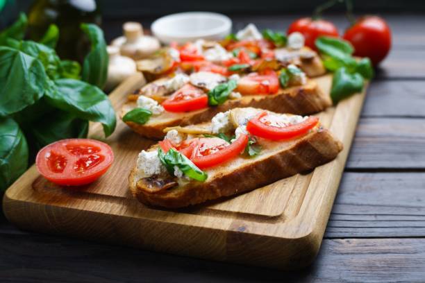 istock Traditional Italian antipasti bruschetta with chopped tomatoes, 954487568