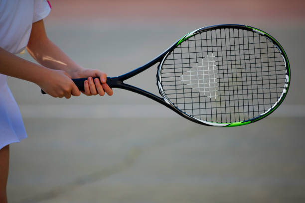 istock Female athlete holding tennis racket 954487578