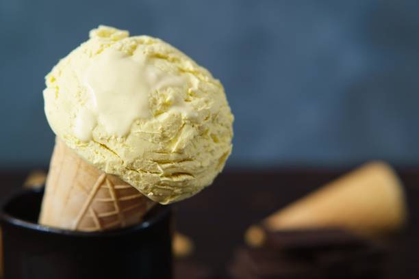 istock Banana ice cream scoop close up, copy space 954491370