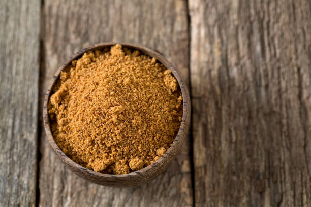 istock coconut palm sugar on wooden surface 954491882