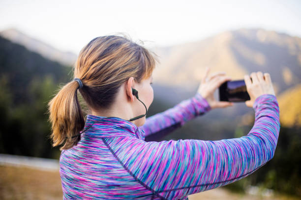 istock Woman Taking a Photo on Mountain Hike 954500182
