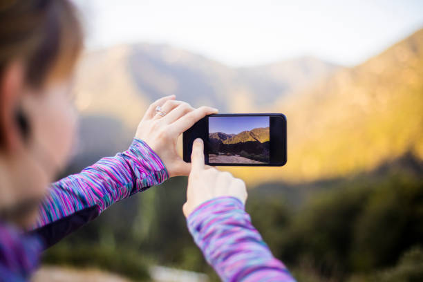 istock Woman Taking a Photo on Mountain Hike 954500230