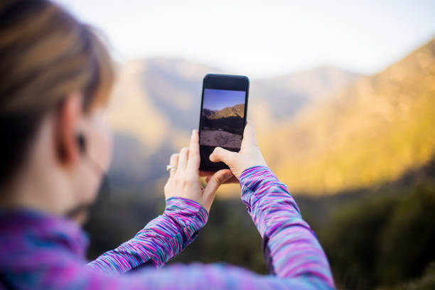 istock Woman Taking a Photo on Mountain Hike 954500236
