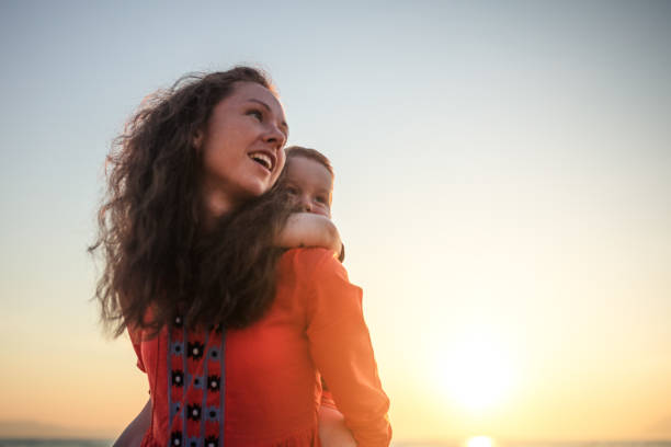 istock Mother playing with the son at sunset 954500688