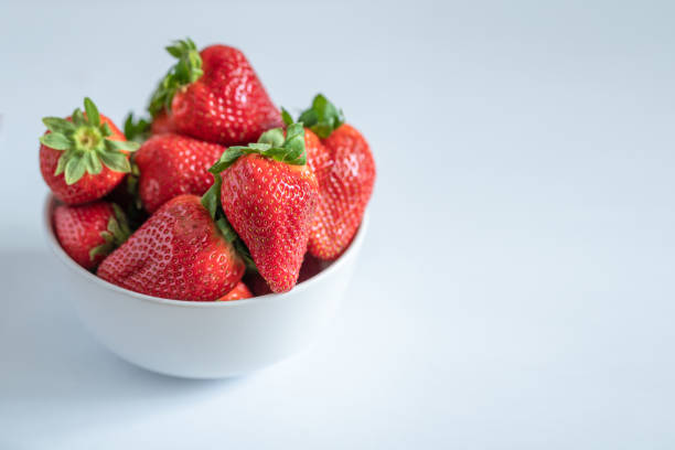 istock Juicy strawberries isolated on white background 954501102