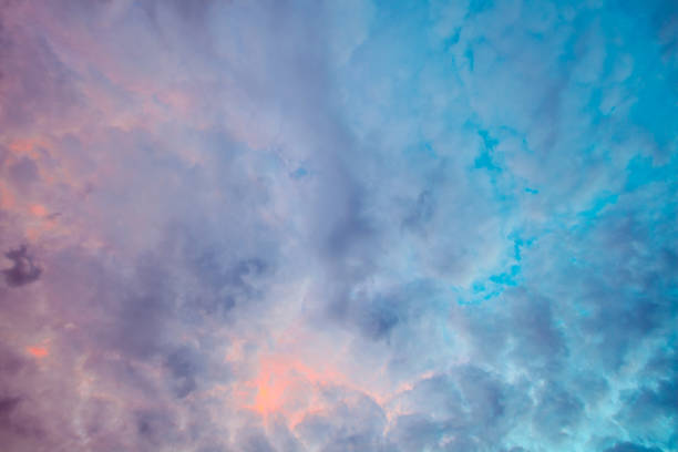 istock Looking straight up at clouds at colorful sunset 954501242