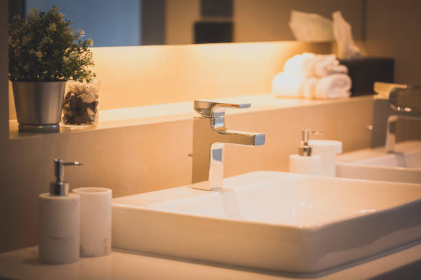 istock closeup faucet in bathroom 954505780