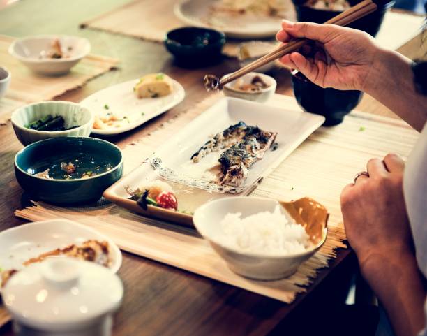 istock People eating Japanese food 954506480