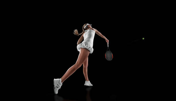 istock tennis isolated on black 954514138