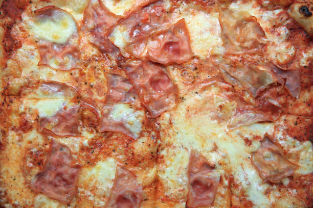 Fresh italian Pizza with Ham, Tomato and Cheese