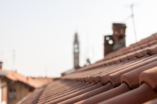 red tile roofs and tower of Italyan town Lomazzo