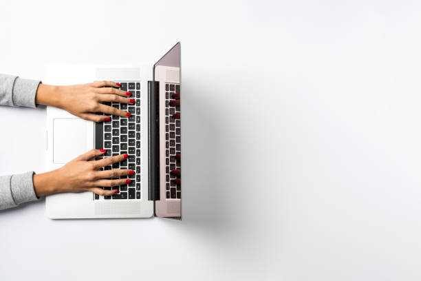 istock Female hands working on modern laptop. Office desktop with copy space. 954528128