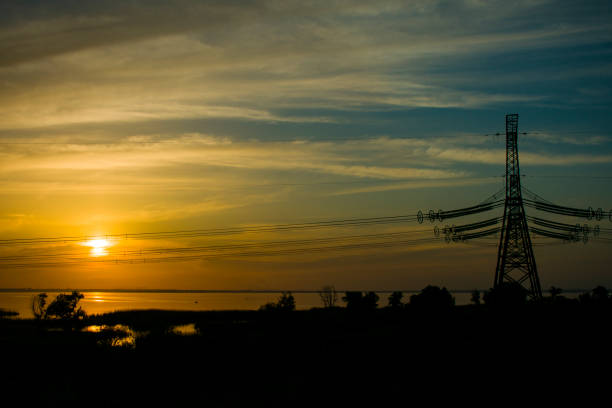 istock electric transmission line at sunset 954528904
