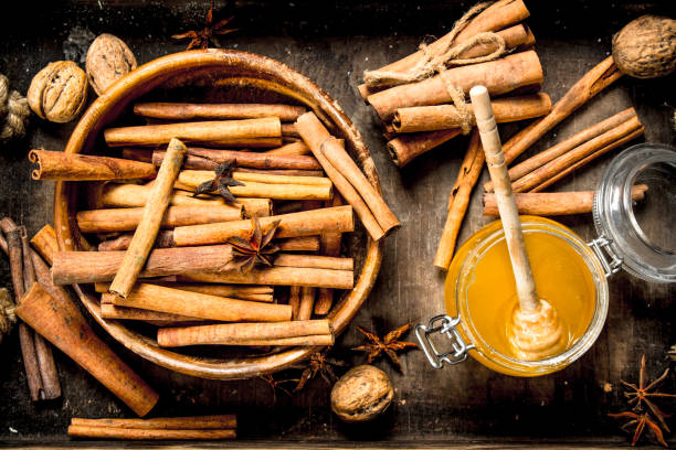 istock Fresh honey with the cinnamon sticks in a bowl . 954529346