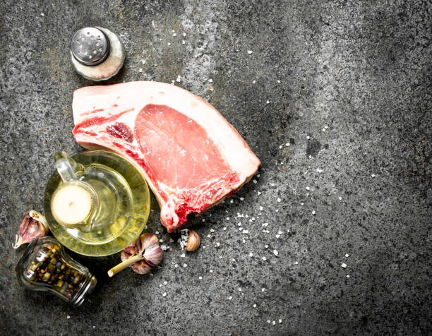 raw pork steak with olive oil and spices. - 5908 imagens e fotografias de stock