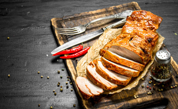 istock Sliced grilled meat on a Board with spices. 954532388