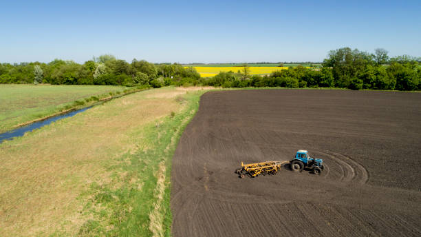 istock Aerial view of a tractor on a field 954532836
