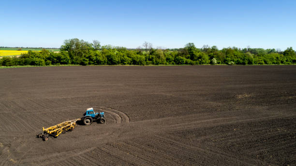 istock Aerial view of a tractor on a field 954532862