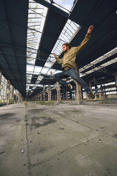 istock Young man jumping in the air 954533180
