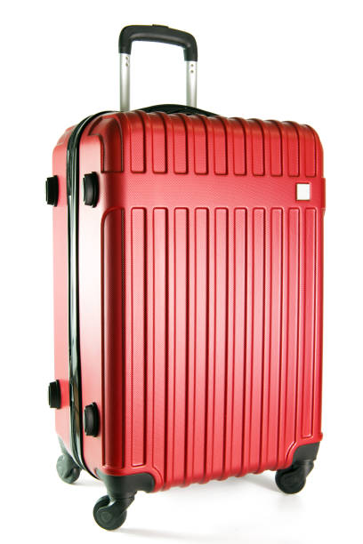 bagaglio da viaggio rosso isolato su sfondo bianco - valigia a rotelle foto e immagini stock