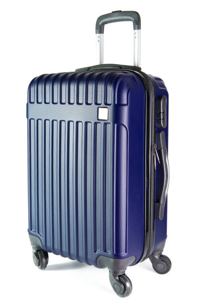 Blue travel luggage isolated on white background Blue color travel suitcase isolated on white background. wheeled luggage stock pictures, royalty-free photos & images