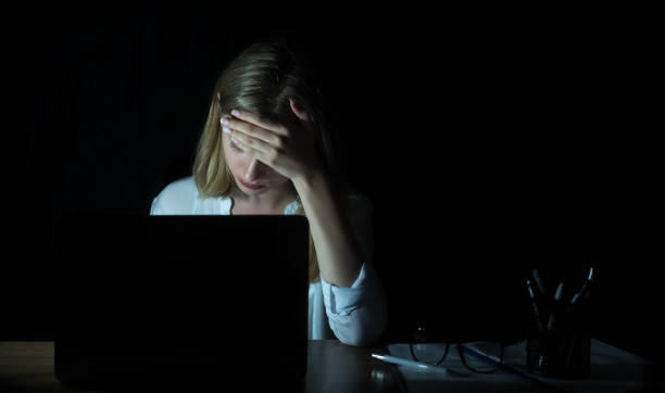 istock Businesswoman on her computer at night 954538312