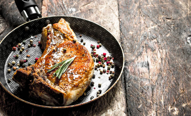 istock Fried slice of pork with spices. 954539362