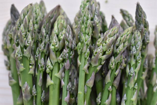 istock Fresh Biologic Asparagus on Wooden Background 954539460
