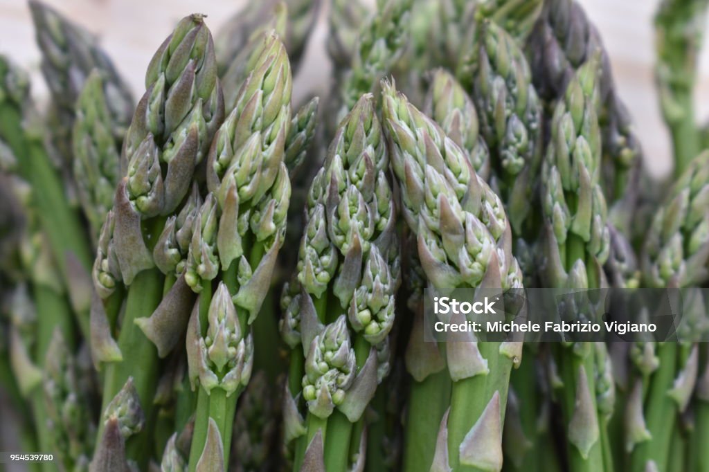 Fresh Biologic Asparagus on Wooden Background Asparagus Stock Photo