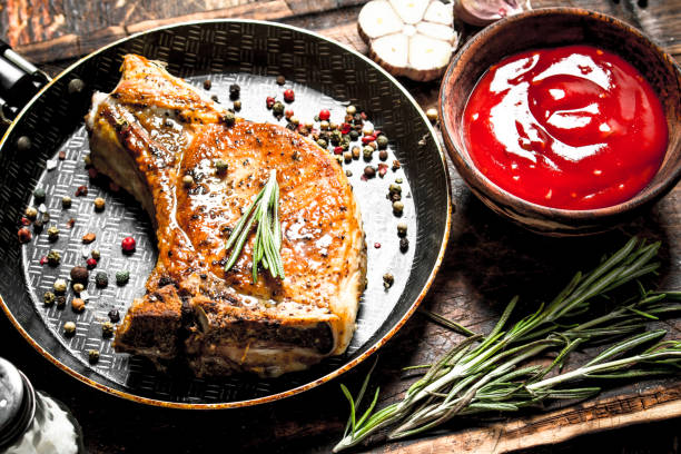 istock Grilled pork steak with tomato sauce. 954540098