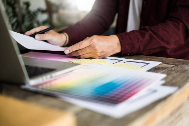istock Web designers concept. Man brainstorming for ideas and sketching at meeting room. 954543336
