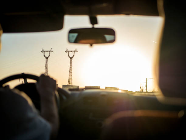 close up man hands on a car rudder while driving it