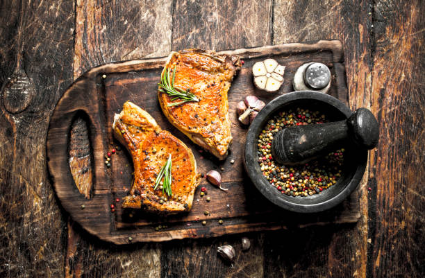 istock Grilled pork steak with spices. 954544264