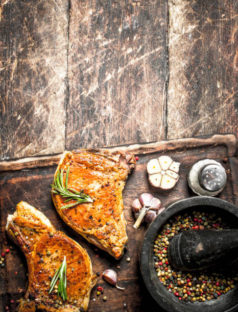 istock Grilled pork steak with spices. 954544328