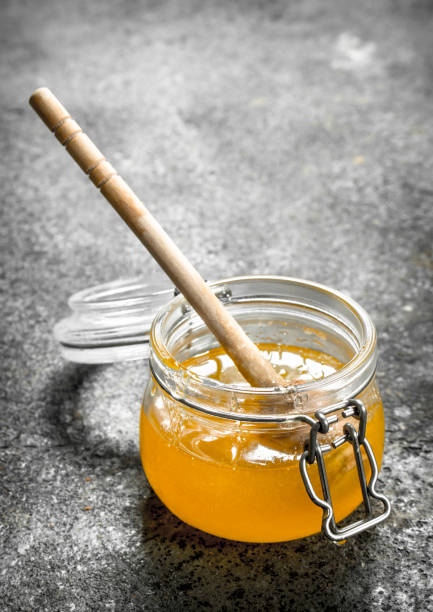 istock jar of fresh honey. 954545328