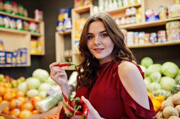 istock Girl in fruits store 954552404