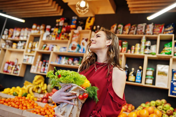 istock Girl in fruits store 954552530