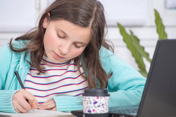 istock a young teenage girl is doing her homework 954552590