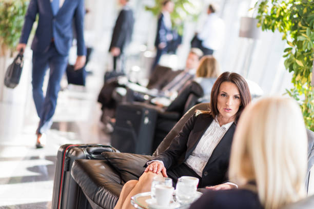 istock Businesswomen Talking While Waiting For A Dalay Flight 954553914