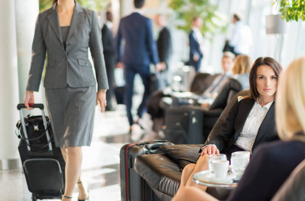 istock Businesswomen Talking While Waiting For A Dalay Flight 954554288